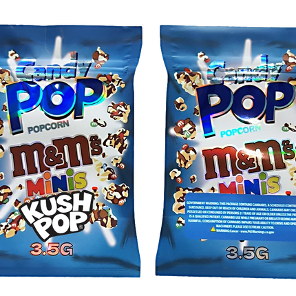 Two Mylar Bag packages of M&M's Popcorn Minis Kush Pop on a white background